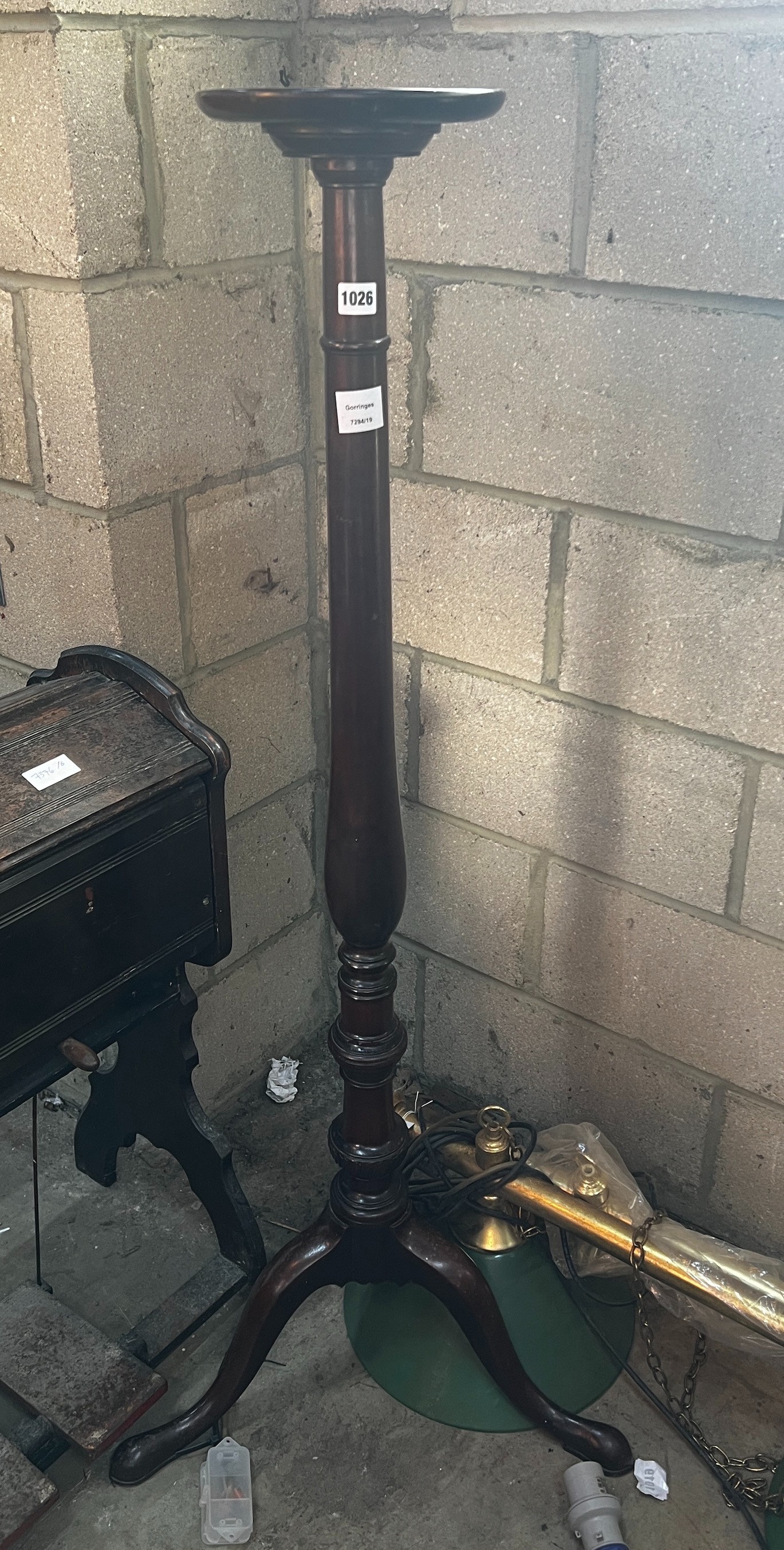 A George III style mahogany tripod torchere, height 134cm